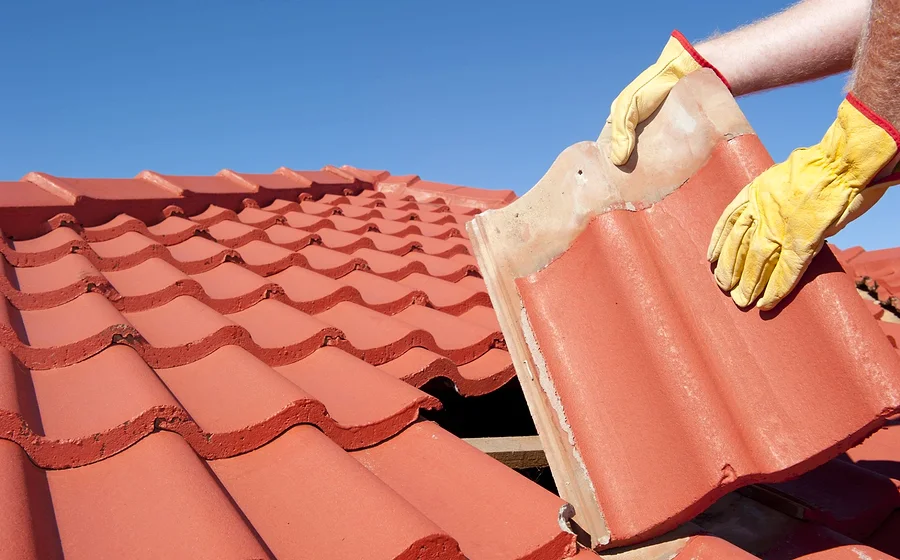 Roof repair — slipped and broken tiles made good